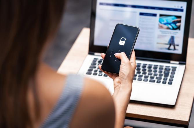 A woman considers her mobile security.