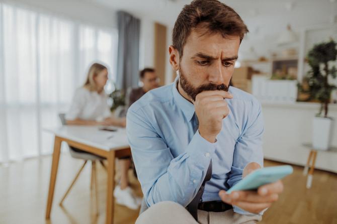 A man looking at his phone