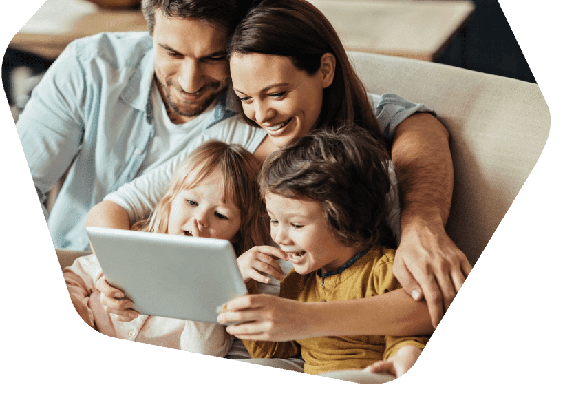 Parents and children watching a tablet together